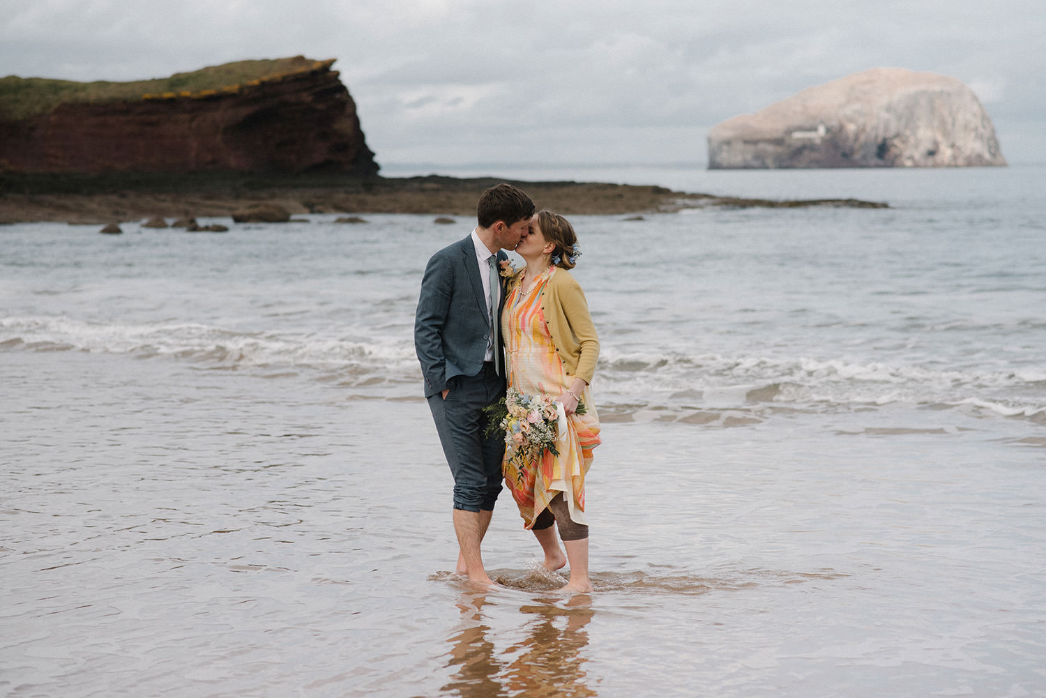 Couple kissing on the Seacliff Beach.