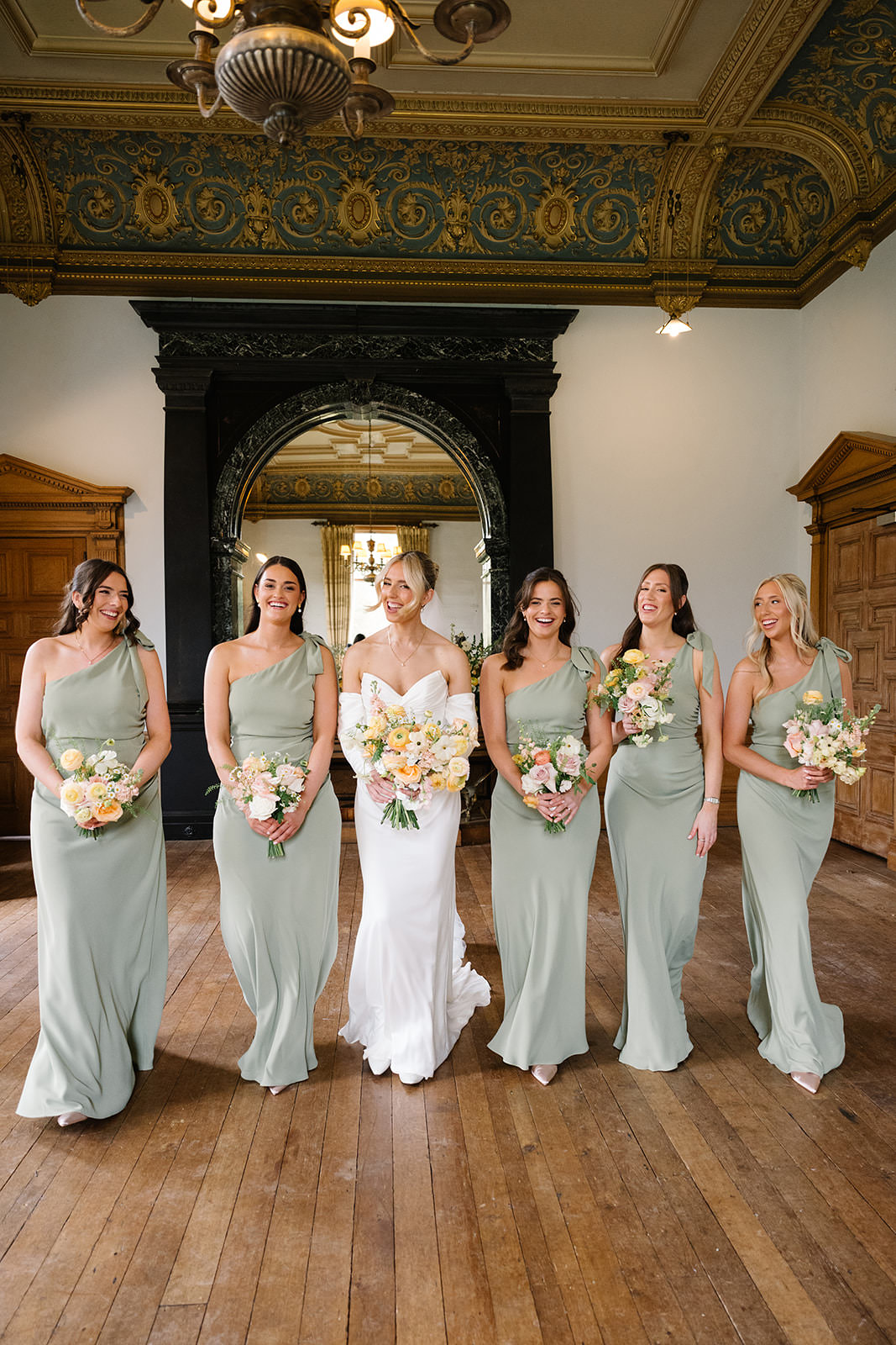 Hannah and her bridesmaids posing for the photos inside Springkell House.