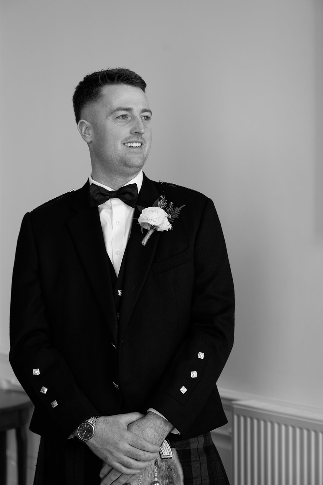 Portrait of the groom captured by 35mm film wedding photographer.