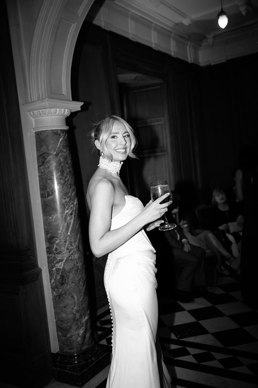 Black and white photo of a bride in the evening.