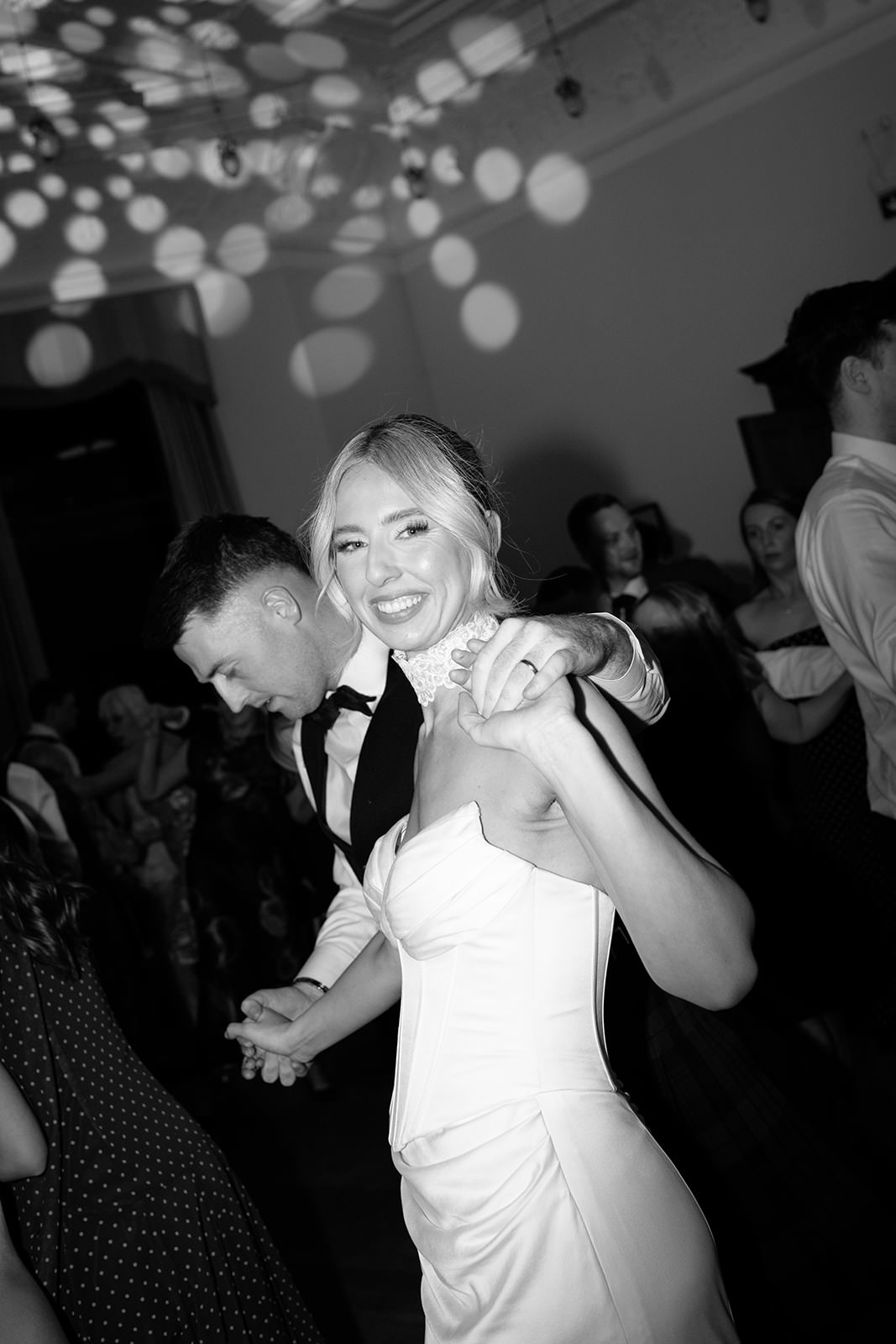 Bride and groom dancing ceilidh at their Springkell House wedding.