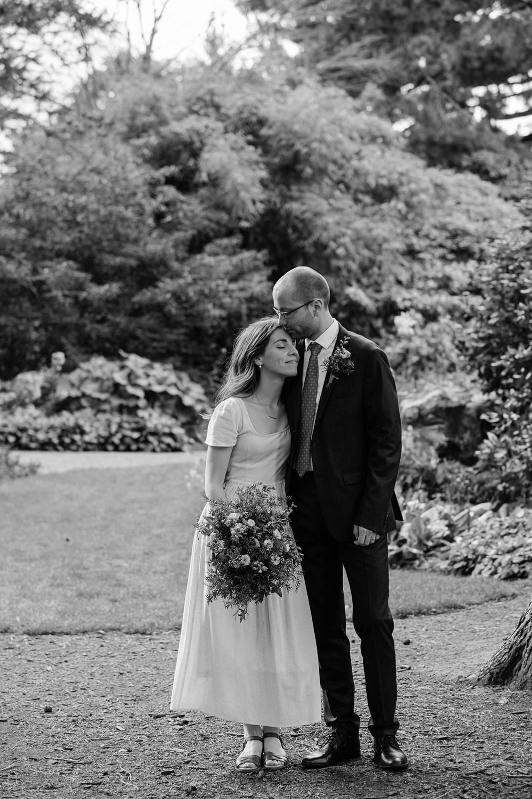 Timeless and nostalgic wedding photographer in Edinburgh captures wedding couple at the Botanic Gardens. 