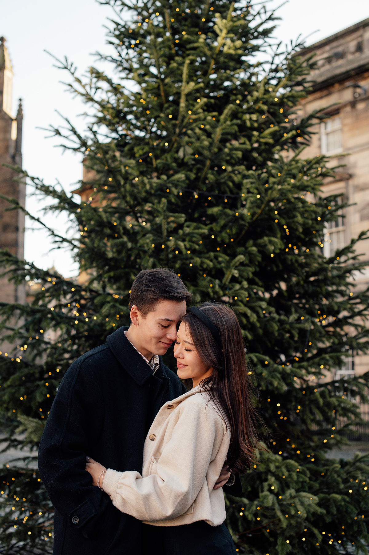 Shermaine and Daryl posing for Scotland wedding photographer in the Old Town.