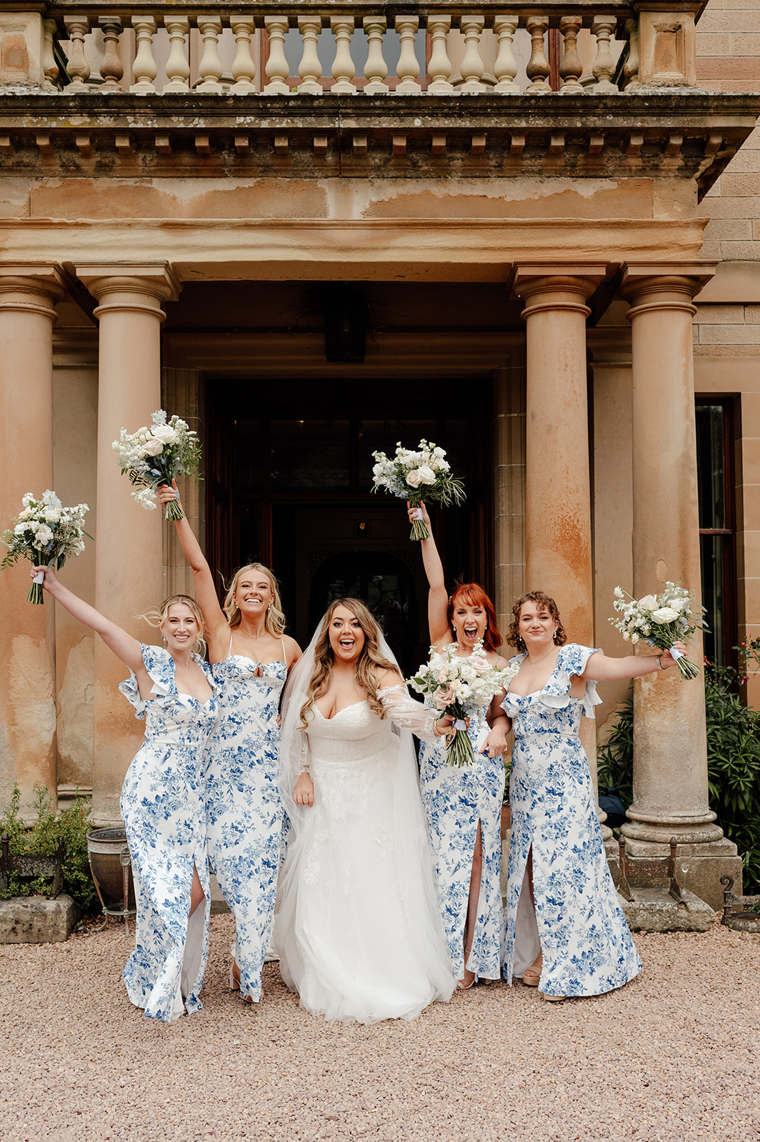 Charlotte and her bridesmaids wearing summer dresses.