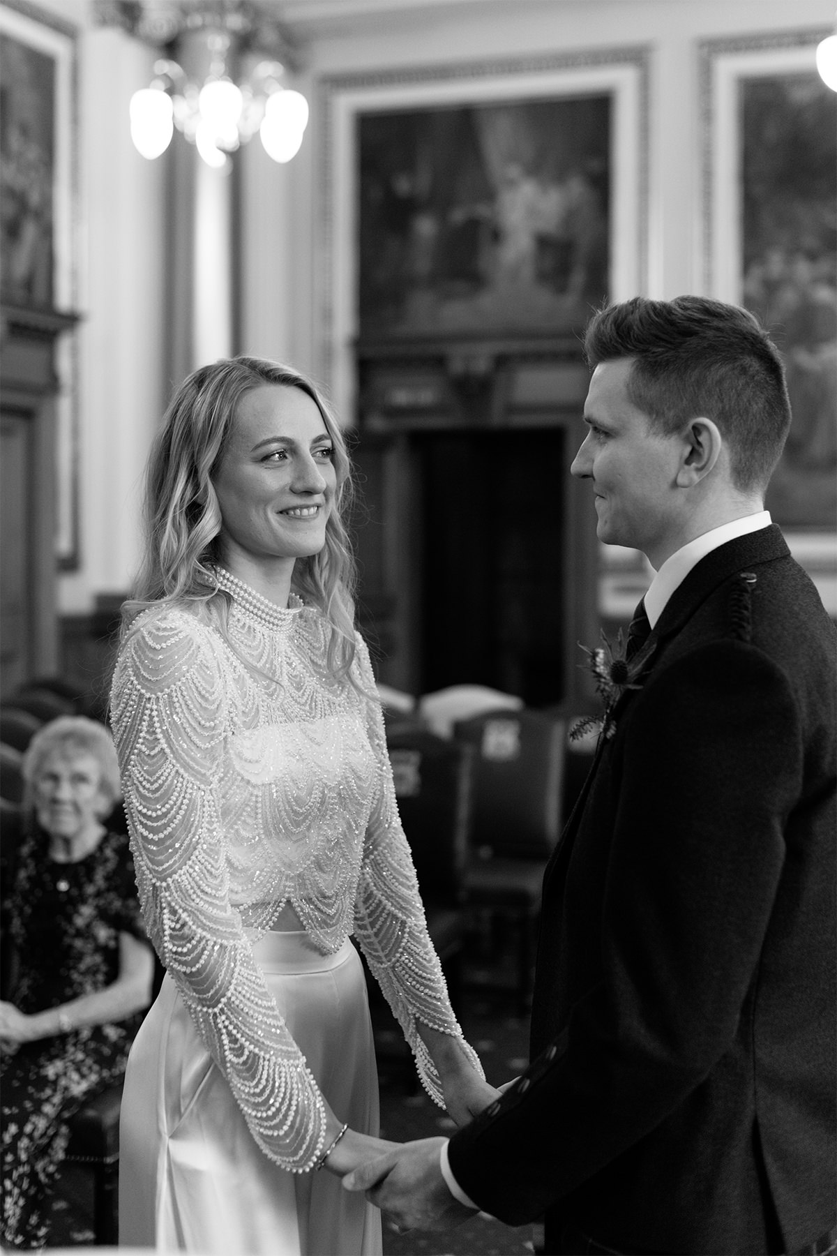 Hannah looking at her husband after wedding vows.