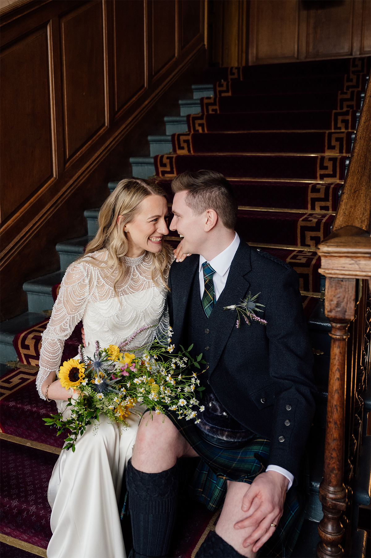 Wedding couple captured by Edinburgh photographer on the stairs of the City Chambers.