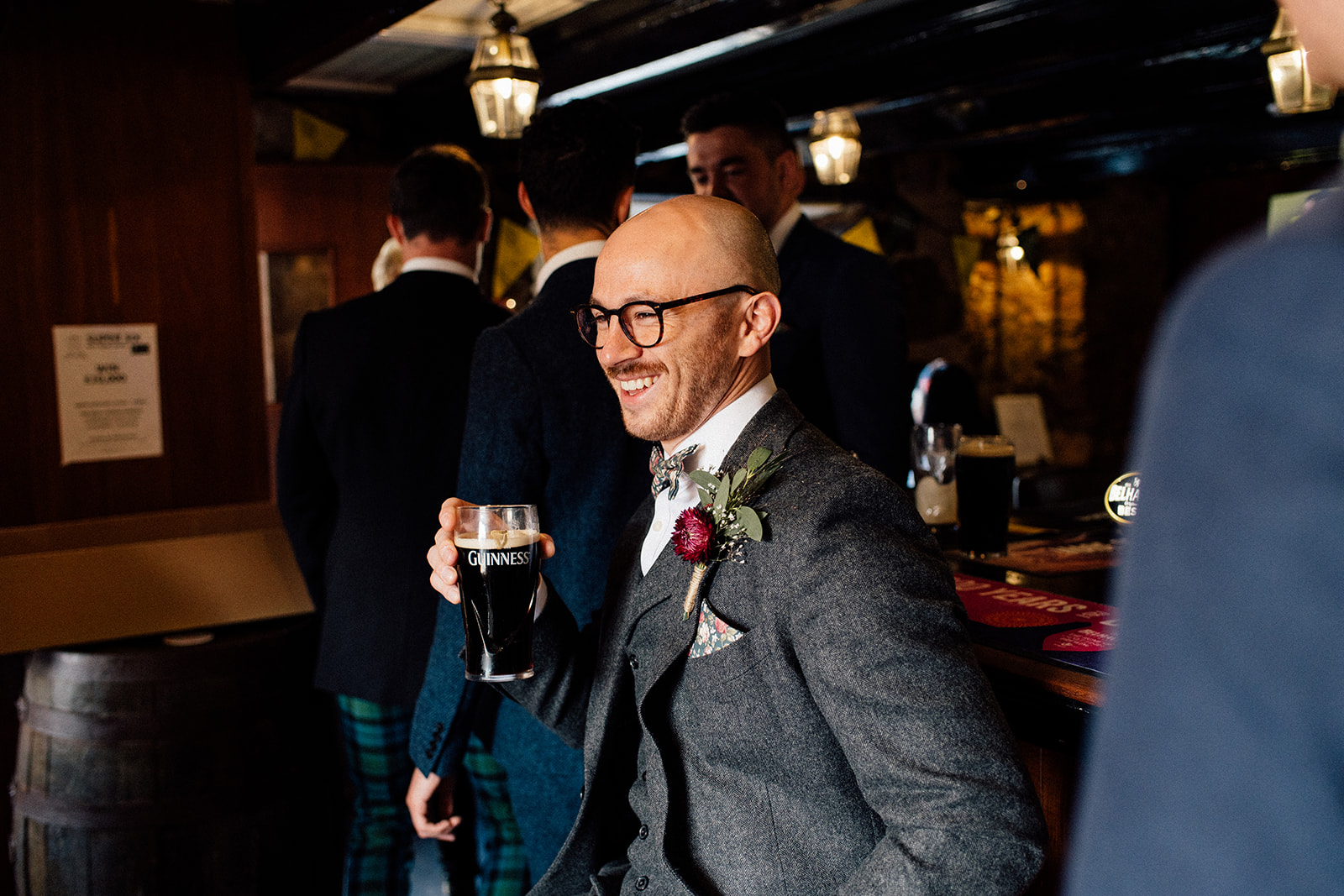 Groom having a pint in the pub,.