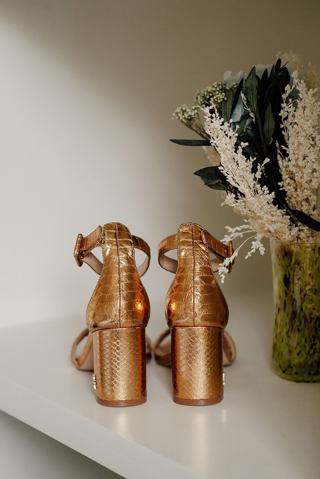Bride's golden wedding shoes.