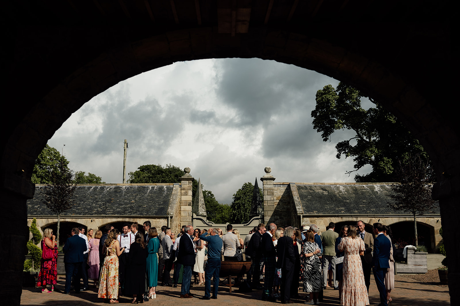 Wedding guests enjoying drinks reception at the Rosebery Steading.