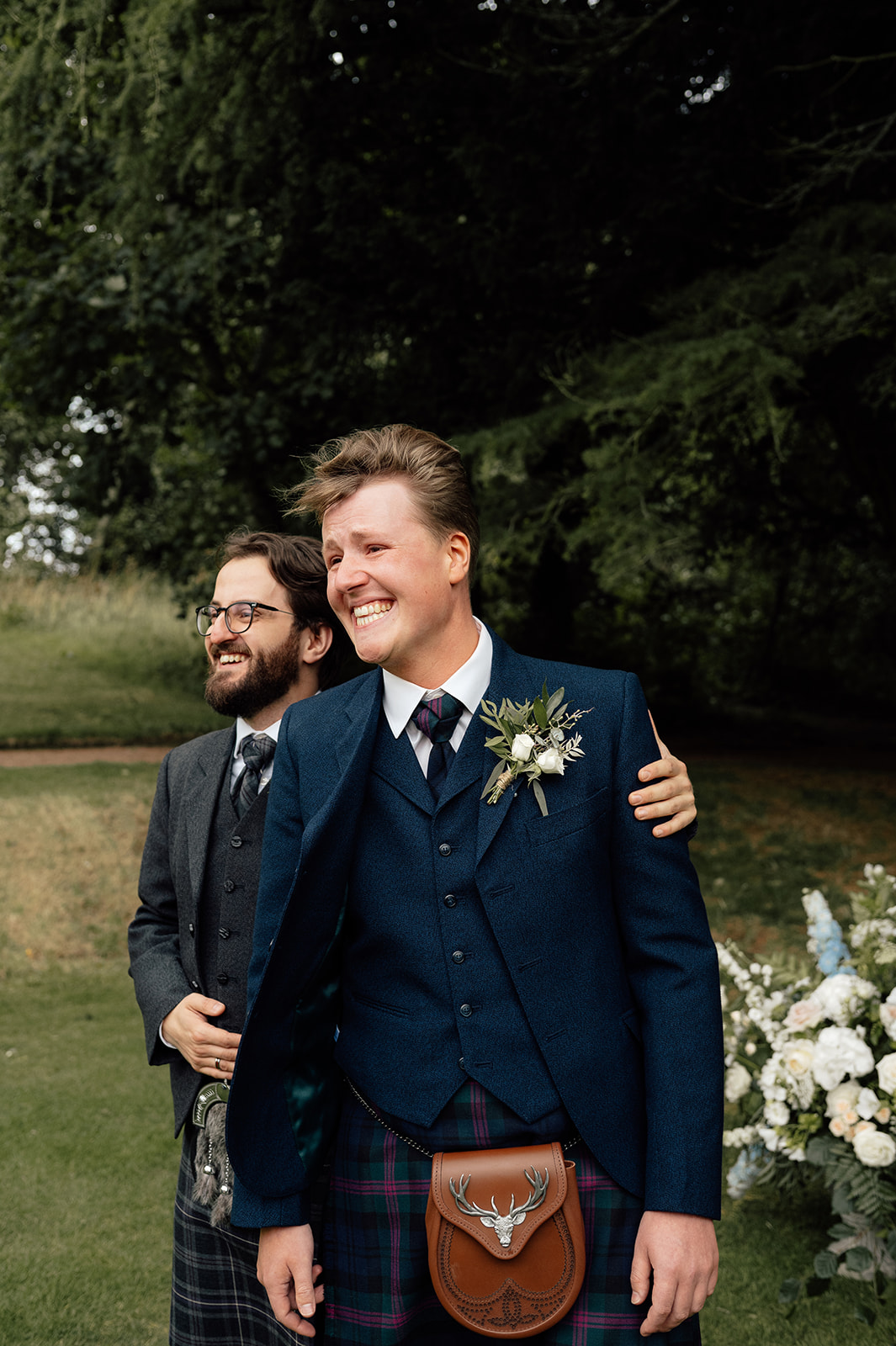 Tom looking at his bride walking down the aisle.