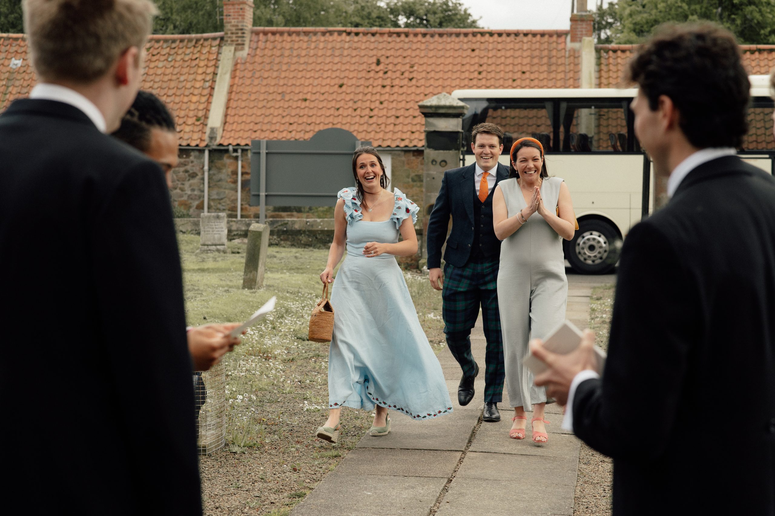 Wedding guests arriving at the church.