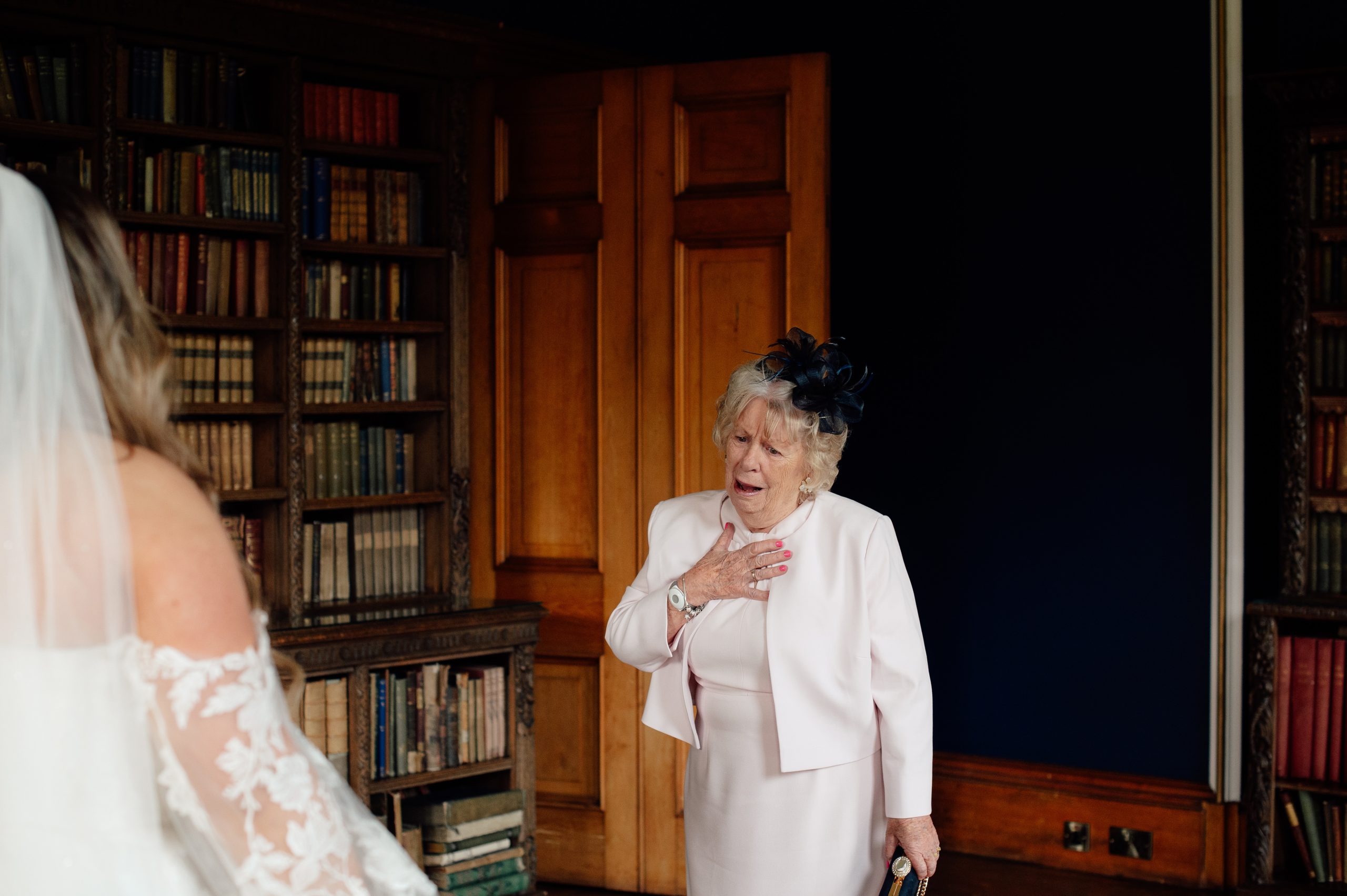 Bride's grandmother looking at the bride at Cambo estate.
