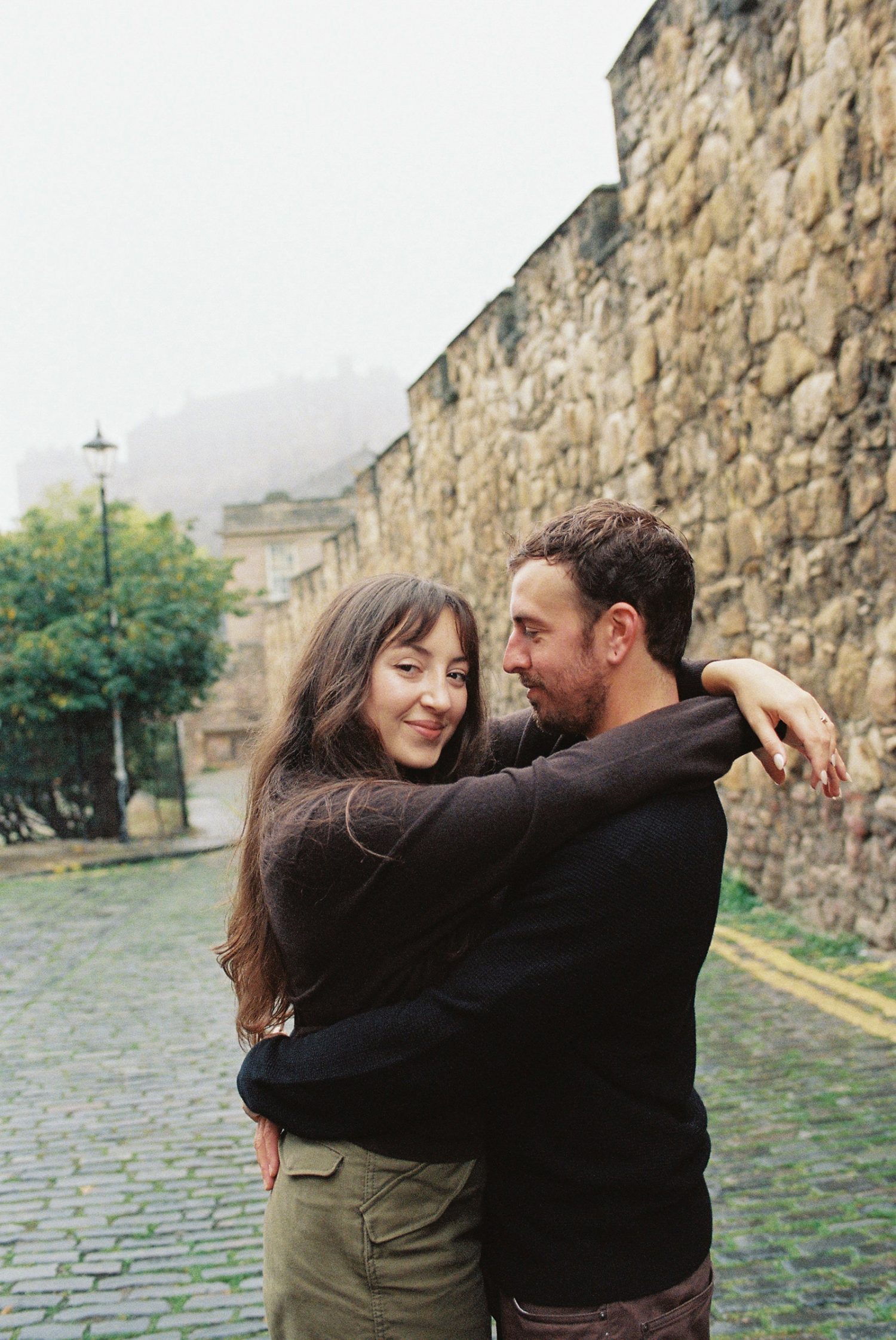 Sara and Brandon cuddling during analogue photography session in Edinburgh