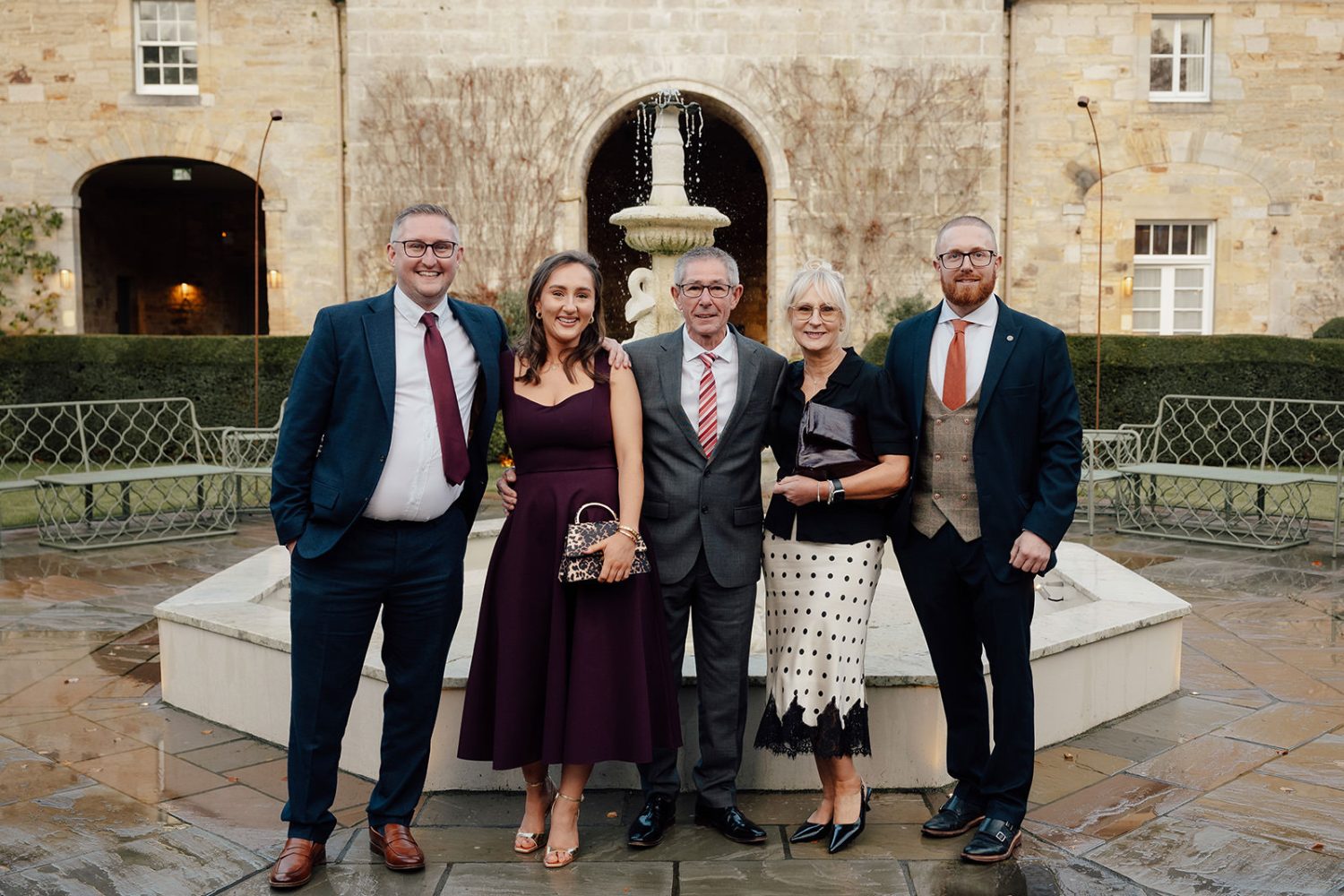 Wedding guest outside the fountain at the Penicuik House.