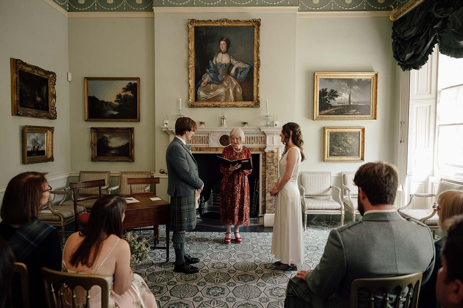 Chloe and Adam saying their wedding vows at the Georgian House in Edinburgh.