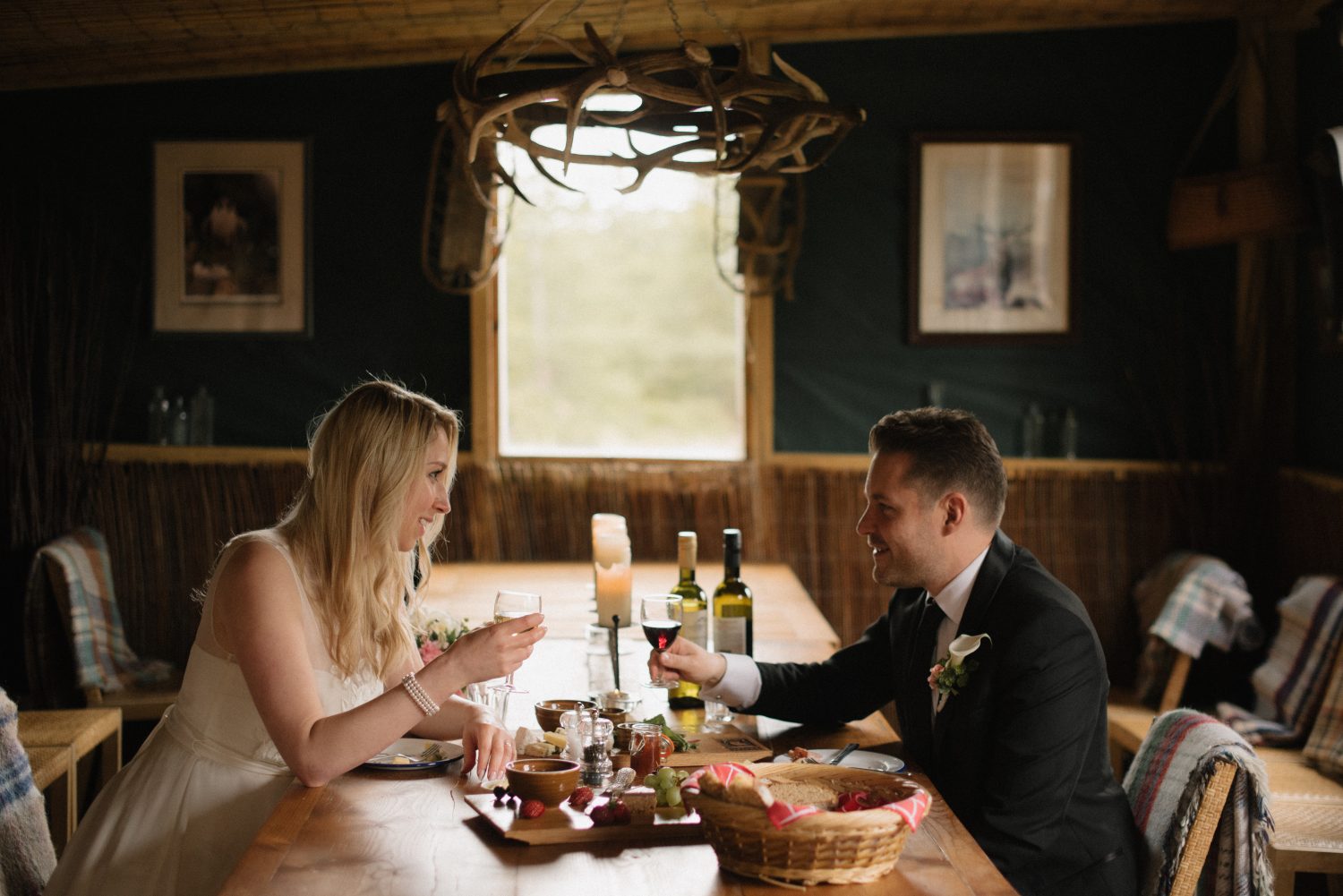 Couple having an intimate meal in the mountain bothy in Scotland. 