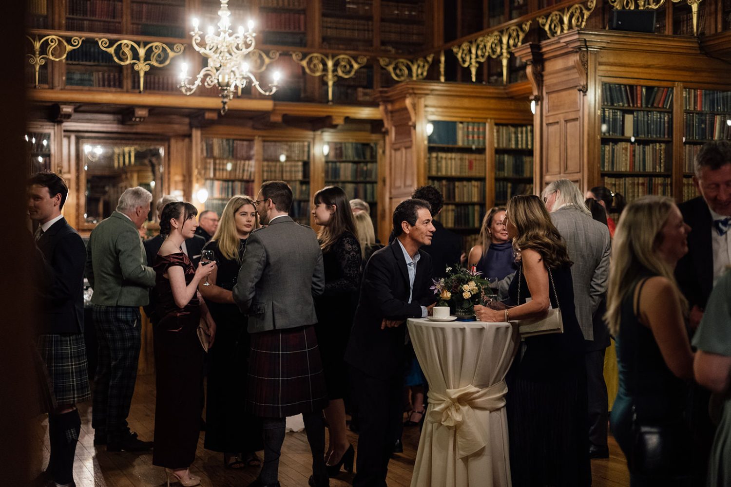 Drinks reception at the library at RCPE wedding venue. 
